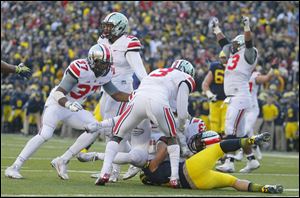 Ohio State’s Tyvis Powell intercepts a pass intended for Michigan’s on a two-point conversion attempt late in the fourth quarter in 2013. The play sealed the Buckeyes' 42-41 victory in Ann Arbor.