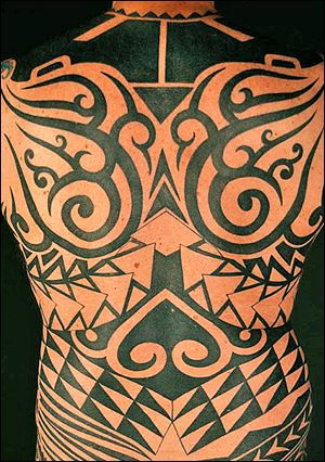 The back portion of a full body tribal style tattoo designed and tattooed by Paul Timman.