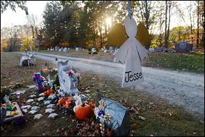 The gravesite of Jesse Lewis, one of the students killed in the 2012 Newtown, Conn., elementary school shootings was covered with mementos shortly after his burial.