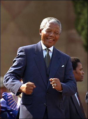 Nelson Mandela, shown in this 1994 photo, dances at a celebration concert in Pretoria, South Africa, following his inauguration as the country's first black president.