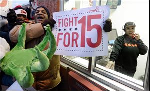 Demonstrators protest for higher wages outside a McDonalds restaurant in Chicago.