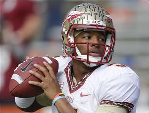 Florida State quarterback Jameis Winston warms up before a game on Saturday.