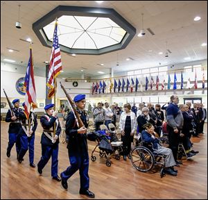 Members of Lorain High School’s Junior ROTC present the colors during a French Legion of Honor ceremony in which six U.S. veterans from Ohio who helped liberate France during World War II were honored.