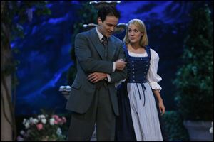 Stephen Moyer, left, as Captain Von Trapp and Carrie Underwood as Maria, in 