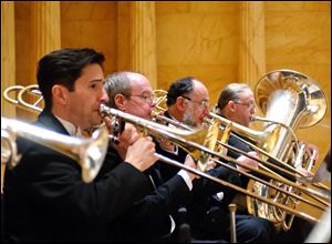 From left: Toledo Symphony brass players Garth Simmons, trombone; Charles Slater, trombone; Daniel Harris, bass trombone, and David Saltzman, tuba, perform at Carnegie Hall in 2011.