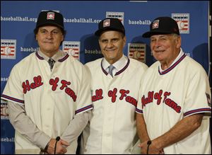 Retired managers, from left, Tony La Russa, Joe Torre and Bobby Cox gather for a photo after it was announced that they were unanimously elected to the baseball Hall of Fame during MLB winter meetings in Lake Buena Vista, Fla., today.