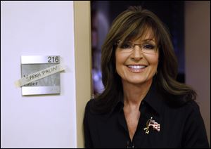 The Sportsman Channel said Monday it has hired Sarah Palin to be host of a weekly outdoors-oriented program that will celebrate the “red, wild and blue” lifestyle.