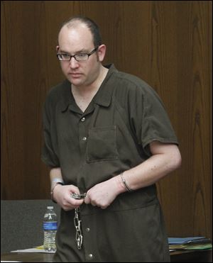 Anthony Bertolina, walks into Toledo Municipal Court today during his arraignment for the murder of his mother, Mary, who was a long-time employee of The Blade's circulation department.