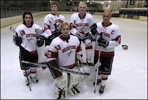 Bedford hockey players from left back: Devin Keener, Josef Molnar, Grant Harper, Jacob Ansara and goalie Austin Grycza, center.