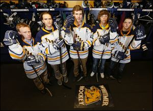 Whitmer High School hockey players  Devin Herzig, Aaron Thoman, Hunter Carr, Cody Calendine.