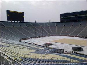Crews start laying the foundation for an ice rink for the Winter Classic at Michigan Stadium.
