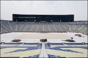 A platform for the hockey rink is laid over the football field for the upcoming Winter Classic at Michigan Stadium in Ann Arbor. The Red Wings will host the Maple Leafs at the stadium on New Year's Day. 