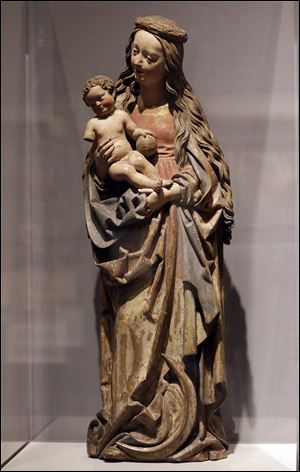 The sculpture “Virgin and Child on the Crescent Moon” by Niklaus Weckmann, owned by the city of Detroit, is displayed at the Detroit Institute of Arts. The fate of Detroit’s art is in question amid the city's bankruptcy proceedings. 