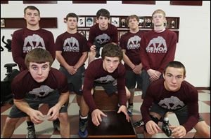 Genoa High School wrestling team members, from left, rear: Tyler Baird, Nathan Moore, Max Reeder, Cody Buckner, and Dustin Widmer. Front row, from left: Jay Nino, Damian D'Emilio, and Brandon Bates.