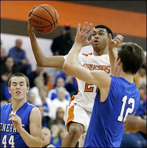 Southview's Jeremiah Roberts takes a shot against Anthony Wayne's Jake Reid (12). Roberts led the Cougars with 12 points.