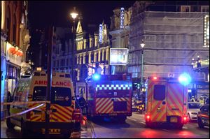 Emergency services attend the scene at the Apollo Theatre in Shaftesbury Avenue today in central London.