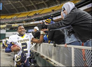 Toledo quarterback Terrance Owens celebrates a 42-41 win against Air Force in the 2011 Military Bowl at RFK Memorial Stadium in Washington. Attendance was 25,042 — capacity is 56,692.