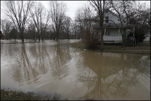 Flood water engulfs the street in front of 337 Wilson St. in Findlay.