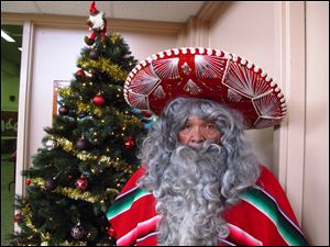 Julian Perez stands in his Pancho Claus suit in Lubbock, Texas. The retired 71-year-old has donned the Pancho Claus suit for 30 years to hand out gifts for low-income and at-risk children. 
