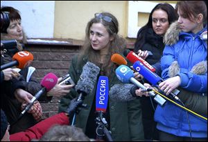 Maria Alekhina, second from left, a member of the Russian punk band Pussy Riot peaks to the media at the Committee against Torture after being released from prison, in Nizhny Novgorod, today.