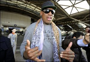  Former basketball star Dennis Rodman speaks to journalists upon arrival at the capital airport in Beijing from Pyongyang, North Korea, today.