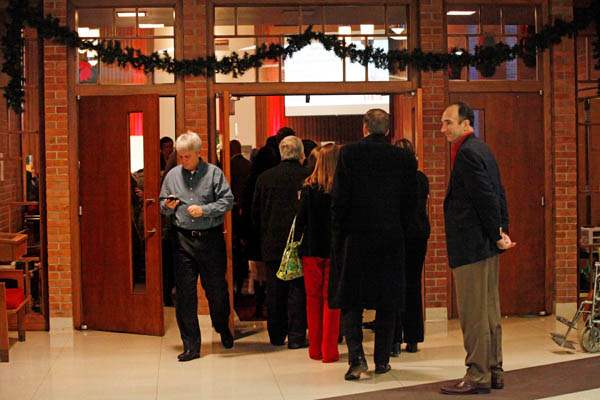 Church-goers-listen-to-carolers-as-they-wait-in-line