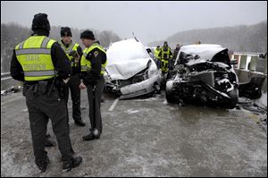 Safety forces work the scene of the pile-up.