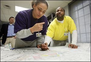 Gang members ‘Kidd,’ left, and ‘King Chaos,’ who were incarcerated at the Lucas County Correctional Treatment Facility, worked on identifying gang territories for a gang map that The Blade assembled.