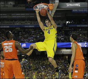 Michigan's Mitch McGary said in a statement that his back problems have been a daily challenge since late August, and that he thought things were moving in the right direction until the last two weeks.