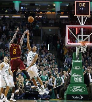 Cleveland Cavaliers' Earl Clark (6) fails to make a 3-pointer over Boston Celtics' Avery Bradley (0) with no time left on the clock in the fourth quarter of an NBA basketball game in Boston.