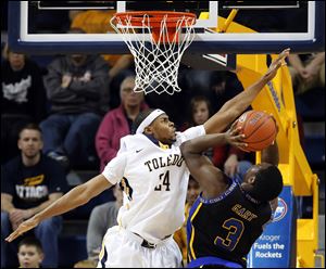 University of Toledo guard J.D. Weatherspoon (24) defends against Coppin State University forward Dallas Gary (3) today.