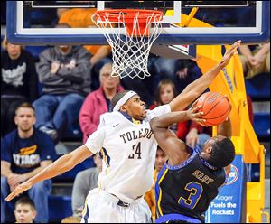Toledo guard J.D. Weatherspoon, who finished with seven points, defends against Coppin State’s Dallas Gary in Saturday’s game at Savage Arena.  The Rockets (12-0) play Monday at No. 16 Kansas.