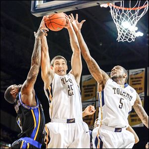 UT’s Jordan Lauf pulls in a rebound against Coppin State’s Andre Armstrong. Lauf led the Rockets with 10 rebounds.