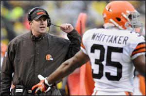 Cleveland Browns coach Rob Chudzinski, left, was fired Sunday following one season, which started promising but ended with a seven-game losing streak.