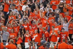 Bowling Green State University fans cheer during a football game this past season. The school is preparing to roll out a new, tougher smoking policy to snuff out cigarettes except in designated areas.