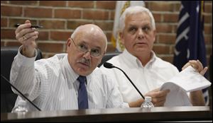 Perrysburg Mayor Nelson Evans, left, has been juggling two duties while finishing the last five months of his term as mayor. In August, he accepted a human resources position at the Wood County Sheriff’s Office.