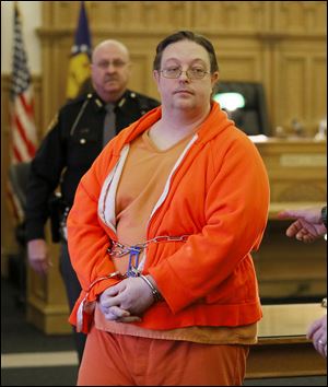 Nathan Brenner, 36, of Liberty Center, Ohio, is led from Judge Robert Pollex’s court after being found guilty of endanger-ing children for the injuries in Emma Zehn-pfennig’s death on March 1, 2012. 