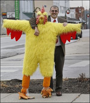 Delta Mayor Dan Miller props up Chuck the Chicken, which will drop in downtown Delta.