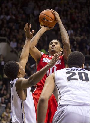  Ohio State's LaQuinton Ross (10) shoots over Purdue's Basil Smotherman (5) in the first half.