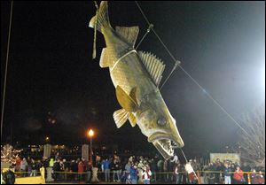 Wylie, a 20-foot long, 600-pound fiberglass walleye, touches down at midnight to welcome 2011 in Port Clinton. This year's festivities will begin at 4 p.m.