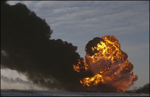 A fireball goes up at the site of an oil train derailment Monday in Casselton, N.D. The train carrying crude oil derailed near Casselton Monday afternoon. Several explosions were reported as some cars on the mile-long train caught fire.
