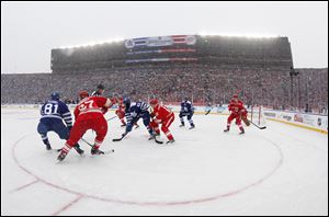 The Toronto Maple Leafs and the Detroit Red Wings face off during the first period of the Winter Classic.