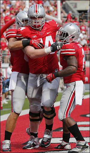 Jack Mewhort, center, helped OSU to the third-best rushing attack in the nation this season.