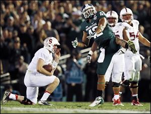 Michigan State defensive end Denzel Drone celebrates his sack of Stanford quarterback Kevin Hogan during the second half of the Rose Bowl. It was MSU’s first Rose Bowl win since 1988.