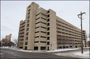The Cuningham Group, a Minneapolis architectural firm, has proposed adding housing, called the Rampton Apartments, on the periphery of an ’80s-era parking garage in Minneapolis. 