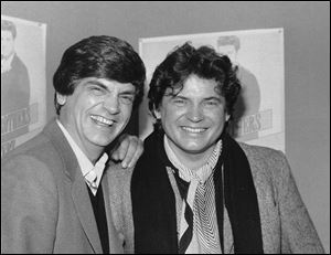 Phil, left, and Don Everly, of the Everly Brothers joke around for photographers in New York City, Jan. 4, 1984.
