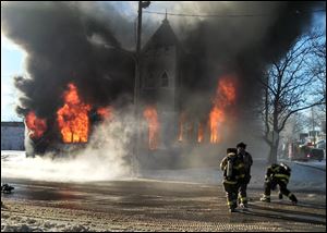 Toledo firefighters battle a fire at Saint Mark Baptist Church in the 1400 block of Fernwood Avenue in Toledo.