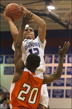 Springfield's Mason Durden puts up two points over Southview's Willie Bankston. Durden had 17 points.