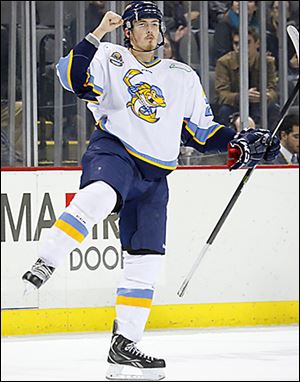 Toledo defenseman Richard Nedomlel celebrates his goal against Reading in the first period on Friday.