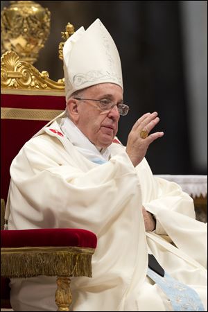 Pope Francis celebrates a mass in St. Peter's Basilica at the Vatican, Wednesday, Jan. 1, 2014. 